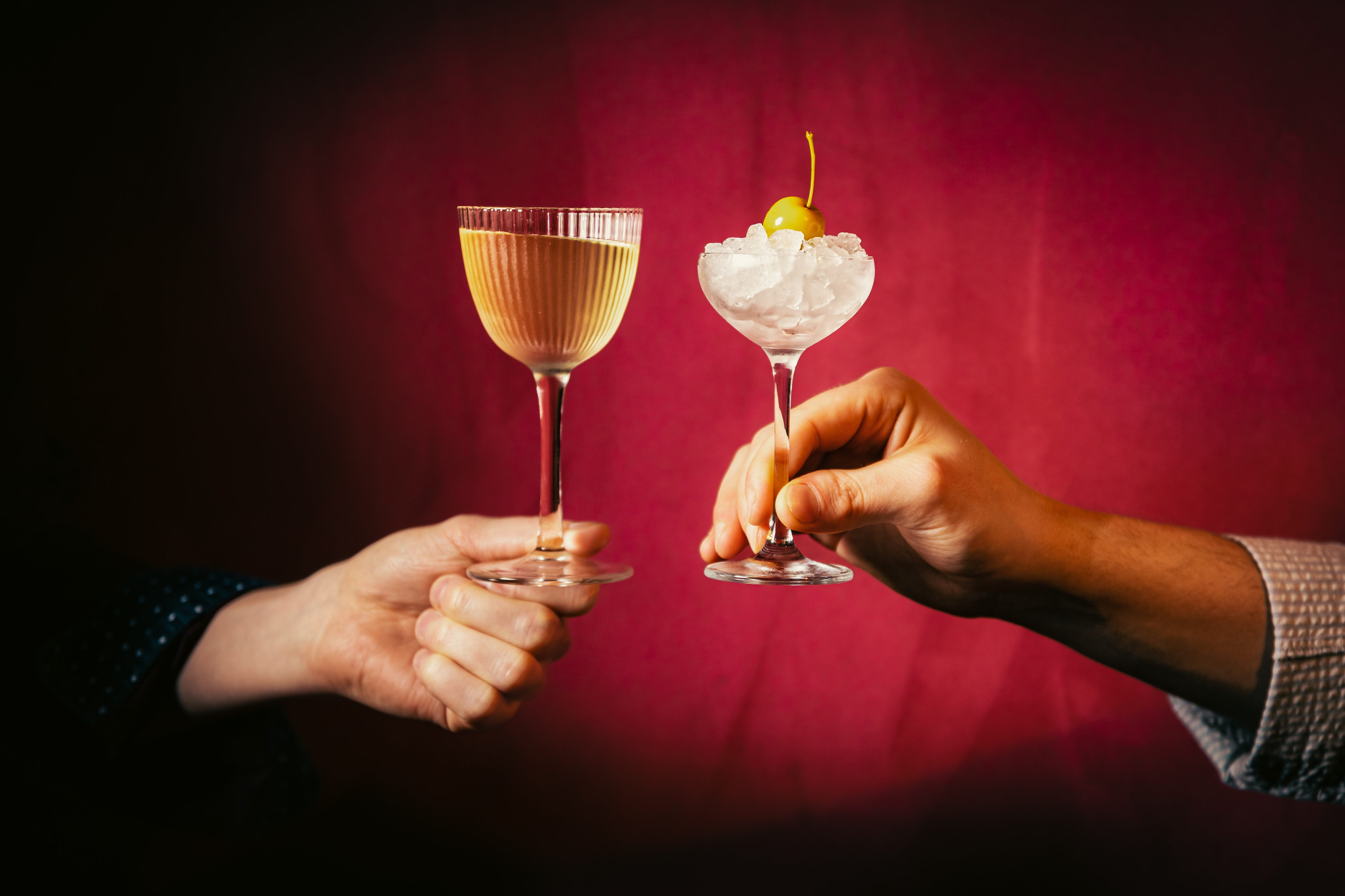 Time Travel Appletini served in a martini glass with an apple garnish on top of ice in a second glass at Seed Library in Shoreditch.
